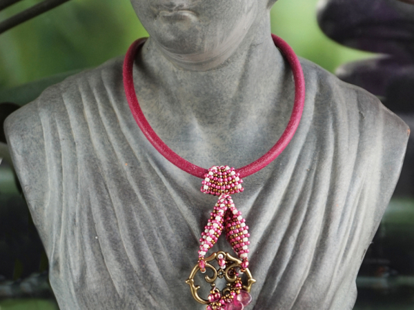 Garden key pendant with reversed winged heart bail and inverted petals