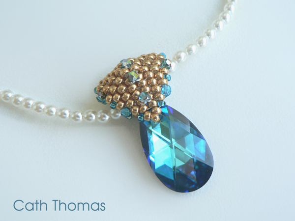 Puffy heart bail with swarovski pendant