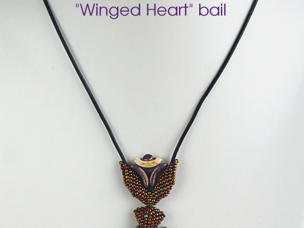 Sun Bow pendant with winged heart bail