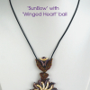 Sun Bow pendant with winged heart bail