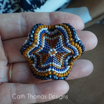 Artemiss  Scarfring in hand to show the other side and size