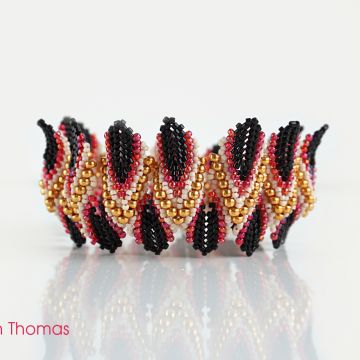 Lotus Bangle, standing. Dimensional peyote with a flames start.