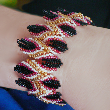 Lotus Bangle, on wrist. Dimensional peyote with a flames start.